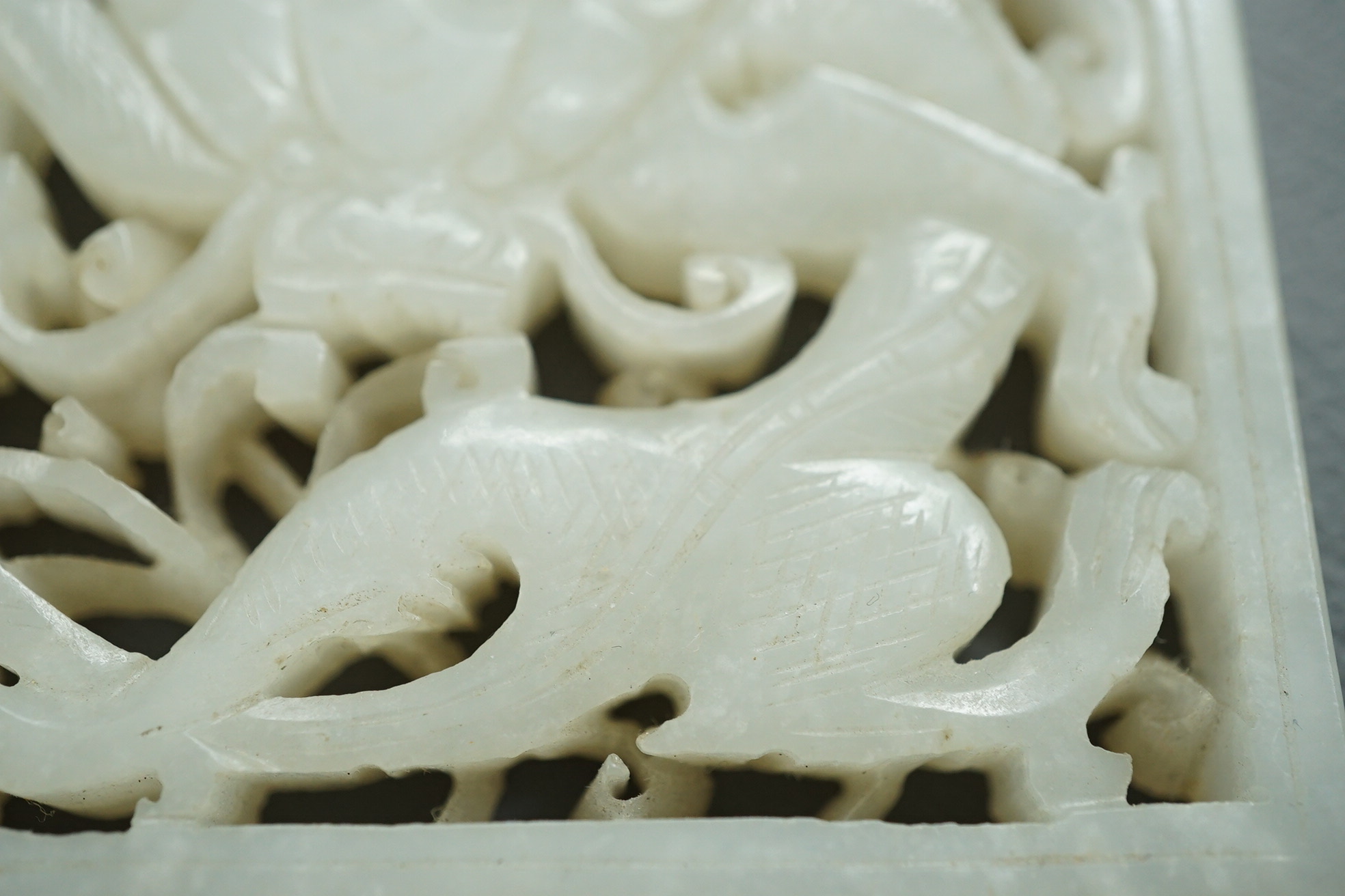 A Chinese white and black jade figure of a recumbent tiger, Song dynasty